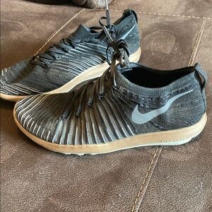 Nike Black and Gold Sneakers with Modern Design